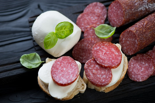 Closeup Of Salami And Mozzarella Cheese Bruschettas, Studio Shot