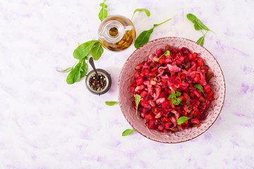Beet salad Vinaigrette in a pink bowl. Top view. Flat lay