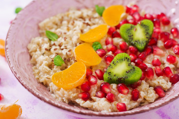 Tasty and healthy oatmeal porridge with fruit, berry and flax seeds. Healthy breakfast. Fitness food. Proper nutrition. Breakfast on Valentine's Day.