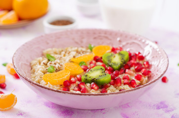 Tasty and healthy oatmeal porridge with fruit, berry and flax seeds. Healthy breakfast. Fitness food. Proper nutrition. Breakfast on Valentine's Day.