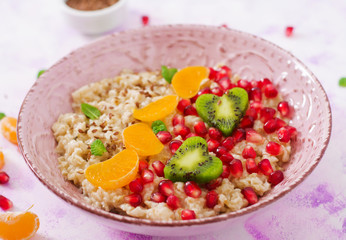 Tasty and healthy oatmeal porridge with fruit, berry and flax seeds. Healthy breakfast. Fitness food. Proper nutrition. Breakfast on Valentine's Day.