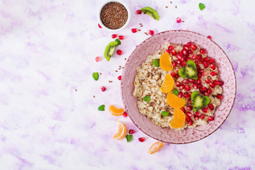 Tasty and healthy oatmeal porridge with fruit, berry and flax seeds. Healthy breakfast. Fitness food. Proper nutrition. Breakfast on Valentine's Day. Top view. Flat lay