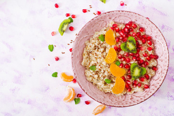 Tasty and healthy oatmeal porridge with fruit, berry and flax seeds. Healthy breakfast. Fitness food. Proper nutrition. Breakfast on Valentine's Day. Top view. Flat lay