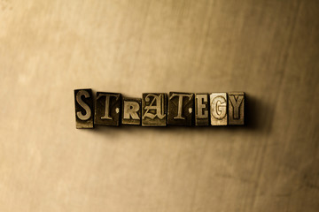 STRATEGY - close-up of grungy vintage typeset word on metal backdrop. Royalty free stock - 3D rendered stock image.  Can be used for online banner ads and direct mail.