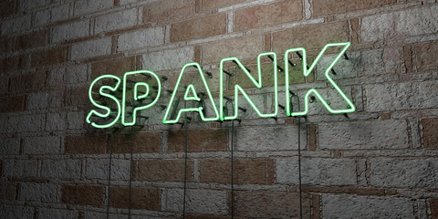 SPANK - Glowing Neon Sign on stonework wall - 3D rendered royalty free stock illustration.  Can be used for online banner ads and direct mailers..