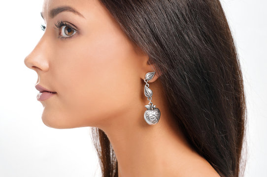 young european model with earring. Close-up portrait