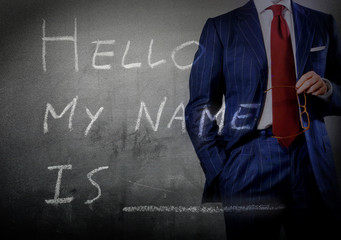 Self Introduction - Hello, My name is ... written on a blackboar