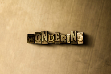 Obraz premium WONDERING - close-up of grungy vintage typeset word on metal backdrop. Royalty free stock - 3D rendered stock image. Can be used for online banner ads and direct mail.