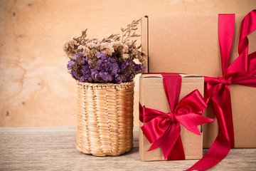 Brown gift box on brown wooden background