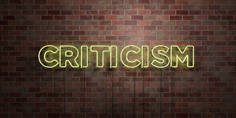 CRITICISM - fluorescent Neon tube Sign on brickwork - Front view - 3D rendered royalty free stock picture. Can be used for online banner ads and direct mailers..