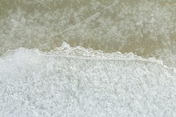 Beautiful ice with abstract cracks. Macro shot.