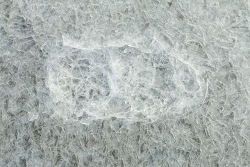 Beautiful ice with abstract cracks. Macro shot.