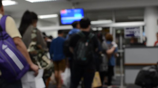 Defocus or Blur of People ( Man, Woman and Child ) on the Line to Departure Boarding to the Airplane.Dark Tone.