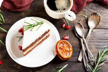 Piece of delicious chocolate cake with orange jam covered with cheese cream. Christmas dinner concept. Selective focus. Top view.