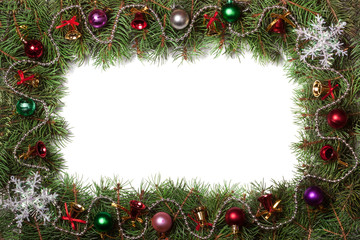 Christmas frame made of fir branches decorated with bells and balls isolated on white background
