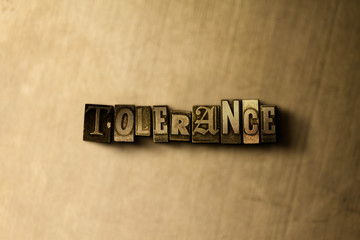 TOLERANCE - close-up of grungy vintage typeset word on metal backdrop. Royalty free stock - 3D rendered stock image.  Can be used for online banner ads and direct mail.