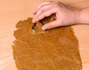 Christmas baking, gingerbread heart cookies with cutter