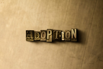 ADOPTION - close-up of grungy vintage typeset word on metal backdrop. Royalty free stock - 3D rendered stock image.  Can be used for online banner ads and direct mail.