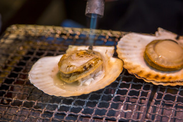 Preparing fresh scallops Tsukiji fish market in Tokyo
