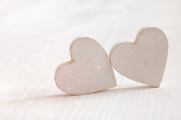 Obraz premium Valentines day background. Couple of wooden hearts