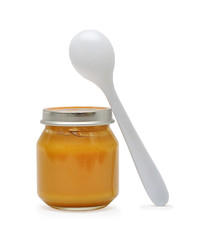 Baby nutrition with spoon isolated on white background