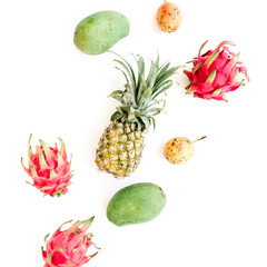 Exotic fruits: mango, pineapple, passion fruit and dragon fruit. Flat lay, top view