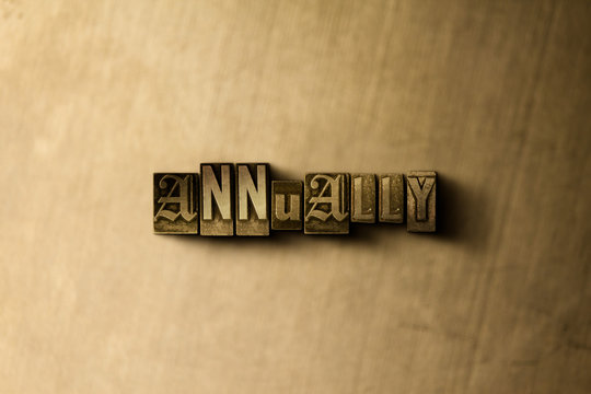 ANNUALLY - close-up of grungy vintage typeset word on metal backdrop. Royalty free stock - 3D rendered stock image.  Can be used for online banner ads and direct mail.