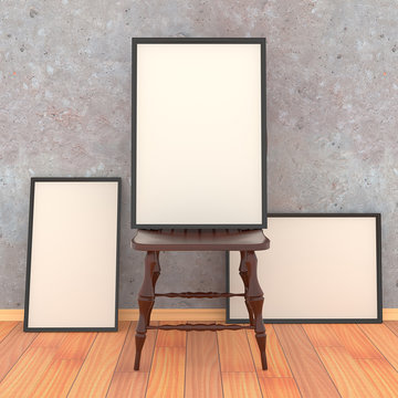 Simple wooden chair with three blank canvas in a black frame on