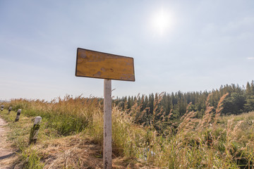 Empty signboard on the side of road in rural area