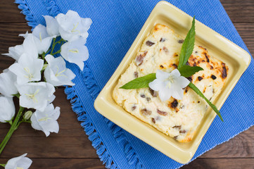Curd pudding with raisins. Wooden rustic table. Close-up. Top view