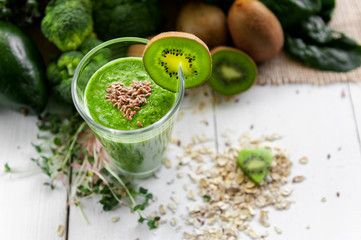 fresh and tasty green smoothie with ingredients