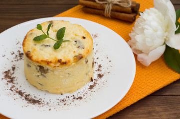 Curd pudding with raisins. Wooden rustic table. Close-up. Top view