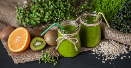 Green smoothies with micro greens, kiwi and orange juice
