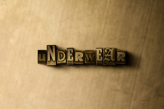 UNDERWEAR - close-up of grungy vintage typeset word on metal backdrop. Royalty free stock - 3D rendered stock image.  Can be used for online banner ads and direct mail.