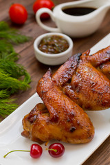 Marinated chicken wings in Japanese. On a wooden table. Top view. Close-up