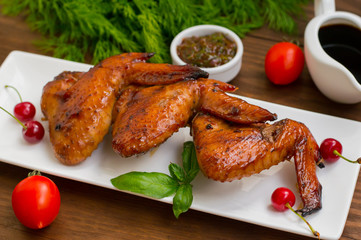 Marinated chicken wings in Japanese. On a wooden table. Top view. Close-up