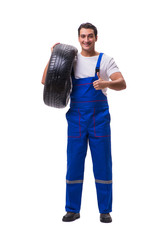 Handsome tyre repairman isolated on white