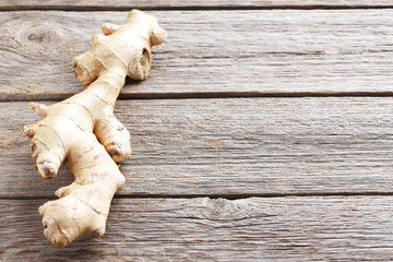 Ginger root on grey wooden table