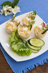 Tartlets with cream cheese  garlic sauce. Wooden background. Close-up