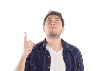 Attractive young man pointing up.