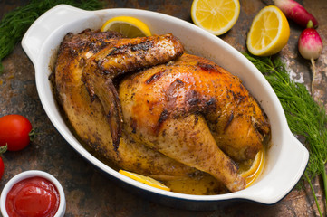 Grilled chicken marinated in balsamic sauce, spicy Italian herbs and fresh lemon. Restaurant supply on a wooden table. Close-up. Top view
