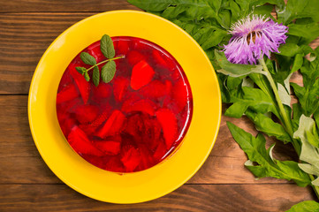 Jelly with strawberries. On a wooden rustic background. Close-up. Top view