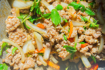 Basil Fried Pork Chops Cooking on a hot pan. Popular food of Tha