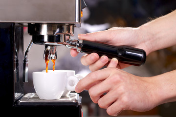 Close up of espresso machine filling two cups