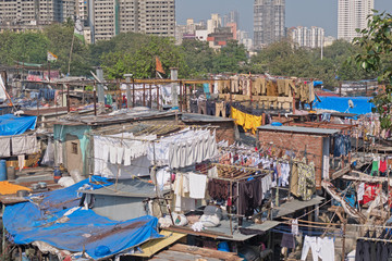 Fototapeta na wymiar Open air laundry next to Mahalaxmi station in southern Mumbai employing 1,000 handwashers, known as Dhobi Wallahs, to deal with the laundry of a large section of Mumbai's residents