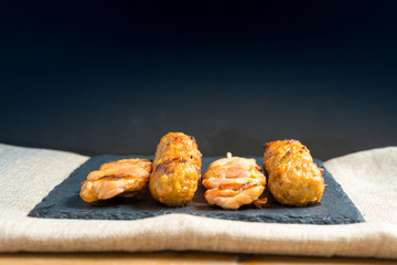 tasty grilled meat and vegetables skewers on a slate plate