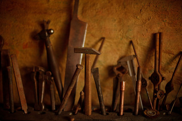 Different metal worker tools on wooden table