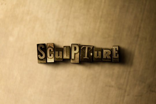 SCULPTURE - close-up of grungy vintage typeset word on metal backdrop. Royalty free stock - 3D rendered stock image.  Can be used for online banner ads and direct mail.