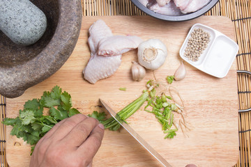 Chef cutting coriander with knife