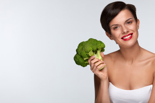 Diet. Beautiful Smiling Woman With Green Broccoli, Healthy Food